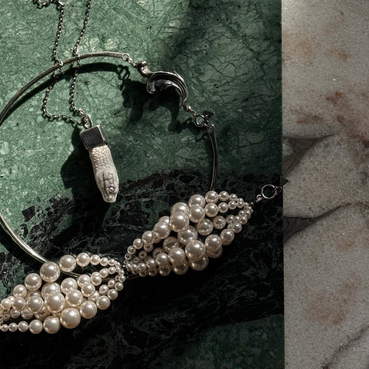 Multi-strand Pearl bracelet on a vivid green marble surface