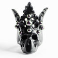Pearl Crown Skull ring black variant — black marble skull with fleur-de-lys pearl crown on white surface | Macabre Gadgets