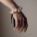 Pearl Lace bracelet worn on a female models wrist