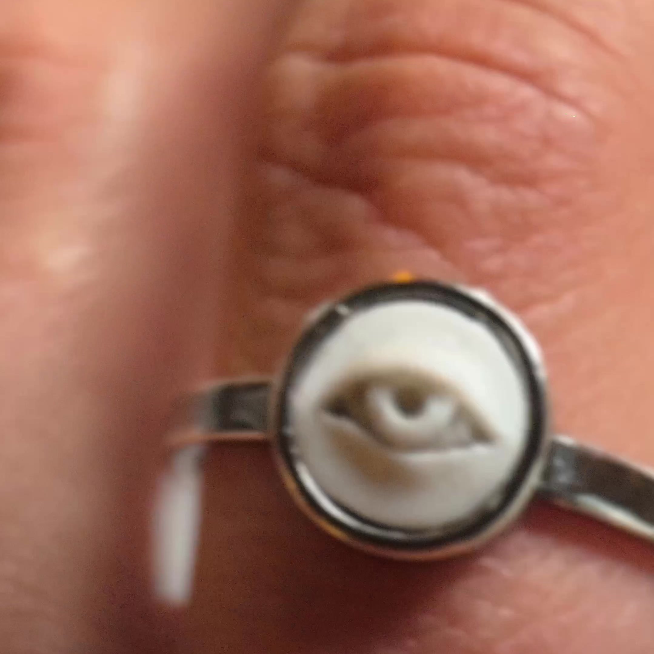 Eye ring - on a models hand, close up to show details of the ring