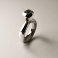 Princess ring - placed on a white background, contrast light complements its glossy surface
