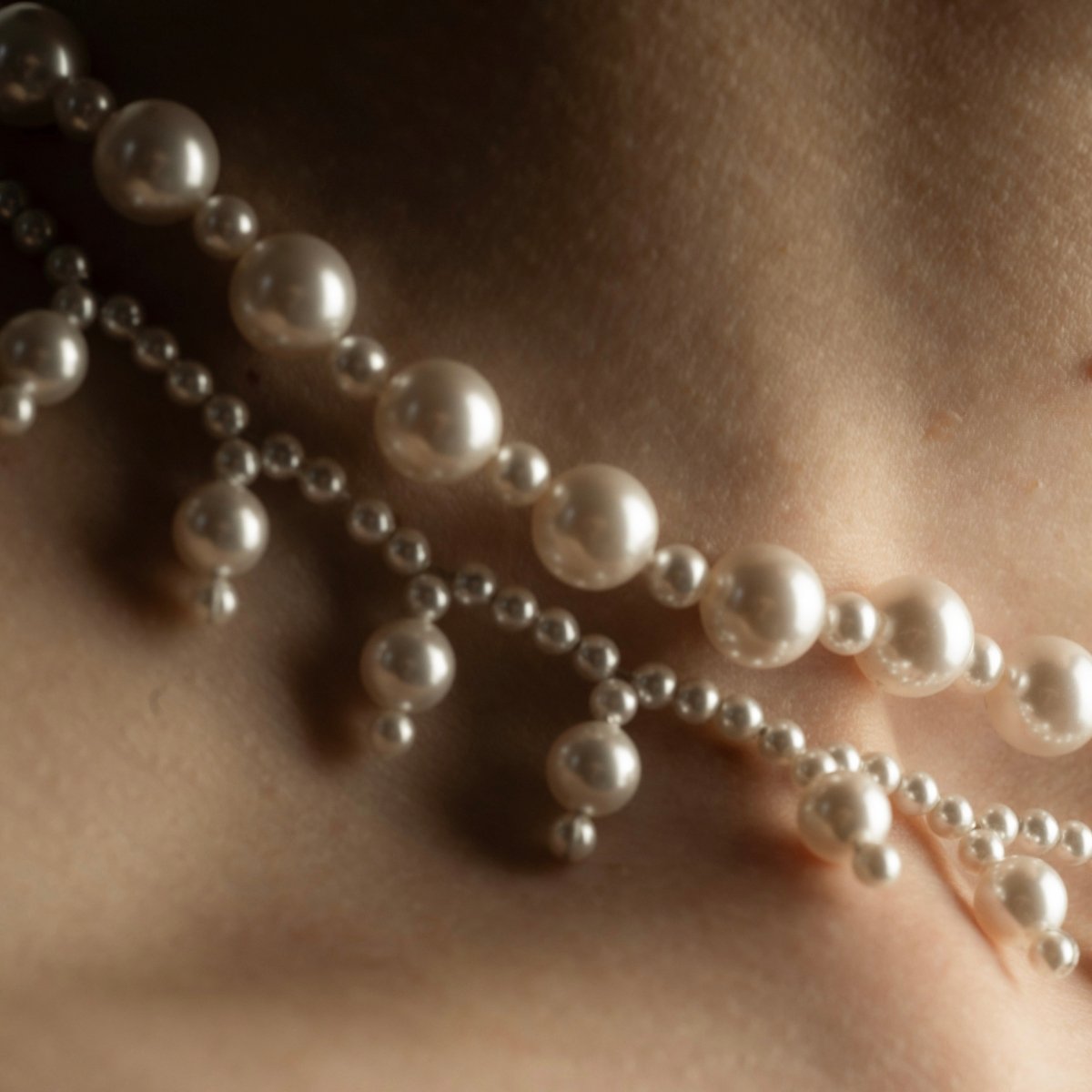 Aegean Pearl choker and Sacred Pearls necklace styled on a female model
