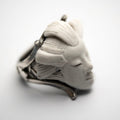 She ring - white variant - placed on a white background, focus on the details of the marble relief