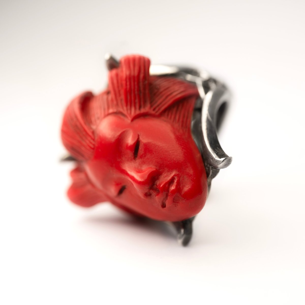 She ring - red variant, on its side - focus on face features, elaborate hairstyle and red glossy finish