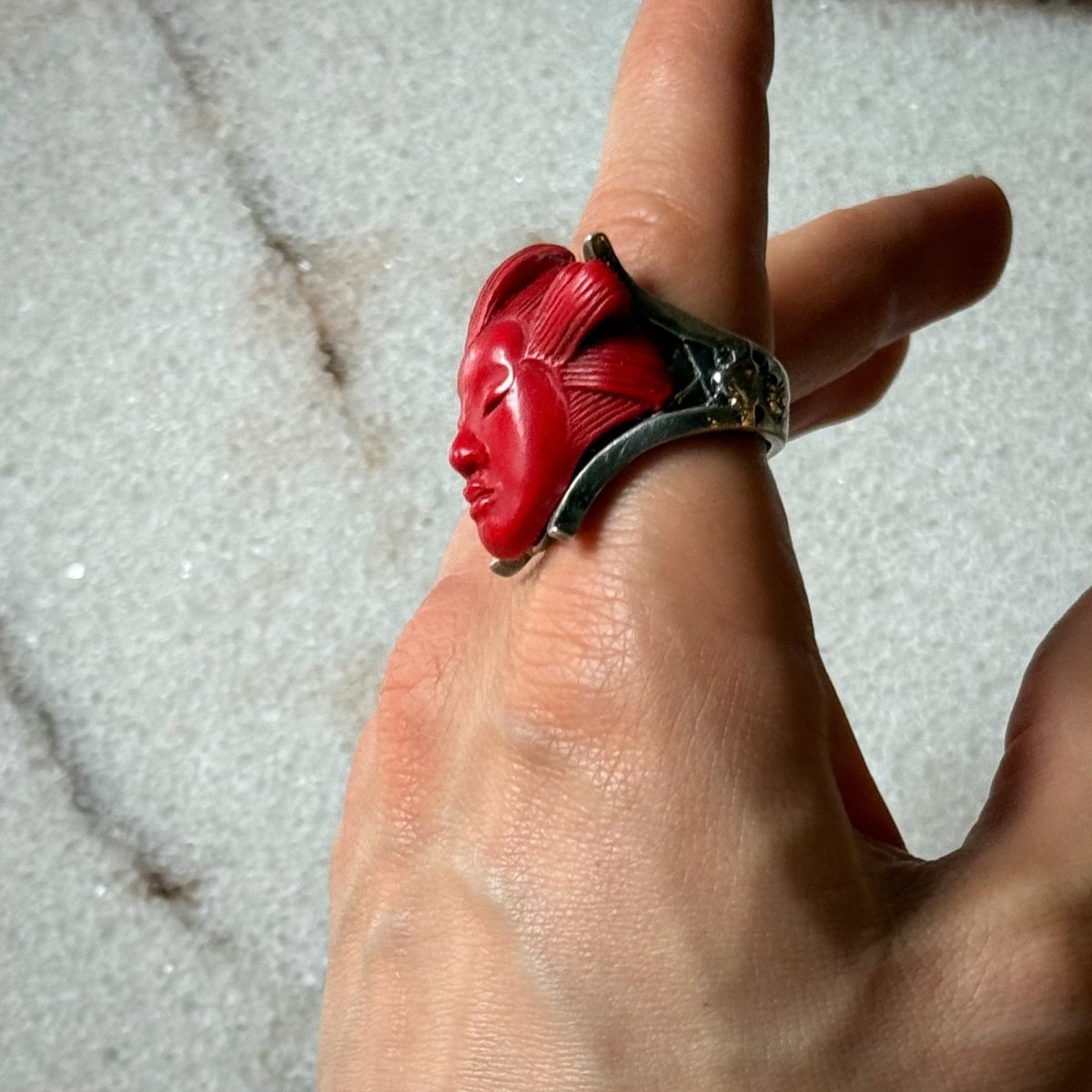 She ring - red variant - on a male model's hand