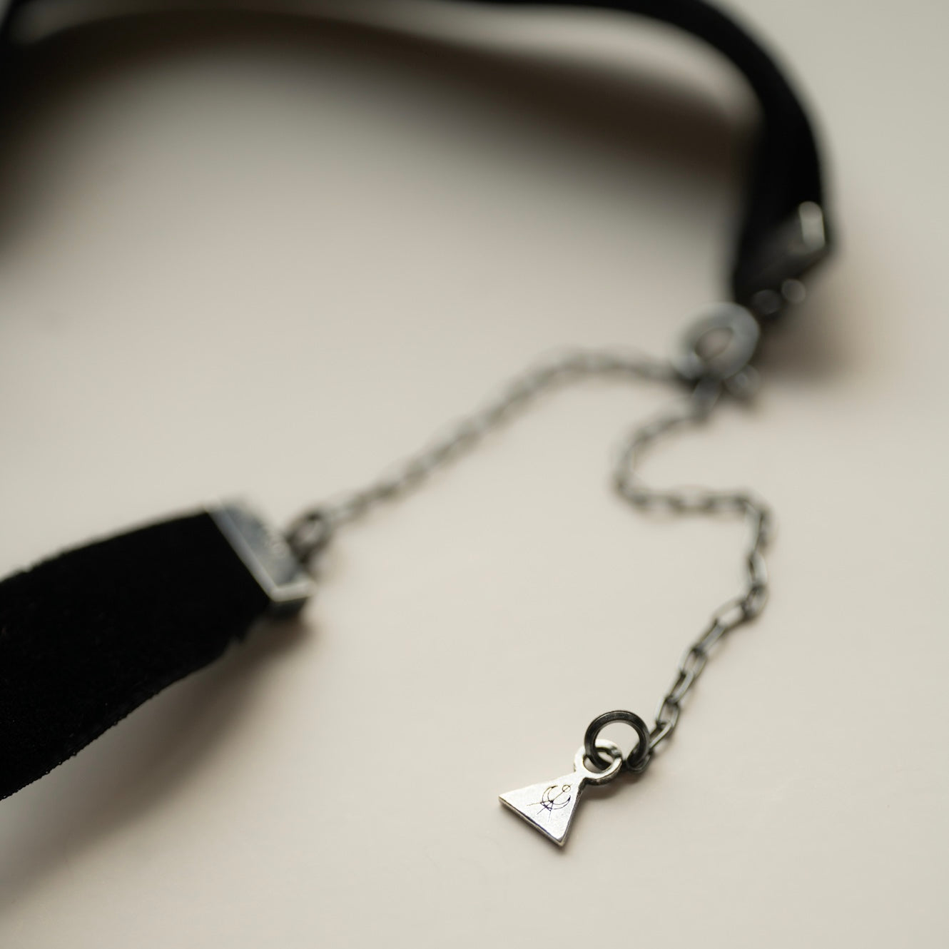 Silver Star Choker — close-up of forged sterling silver fixture and Macabre Gadgets triangular logo seal