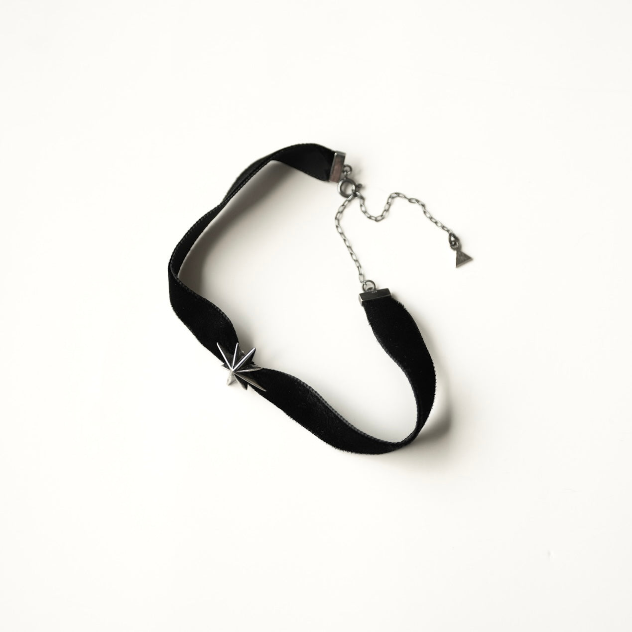 Silver Star Choker full view — black velvet ribbon with sterling silver star, anchor chain and logo seal