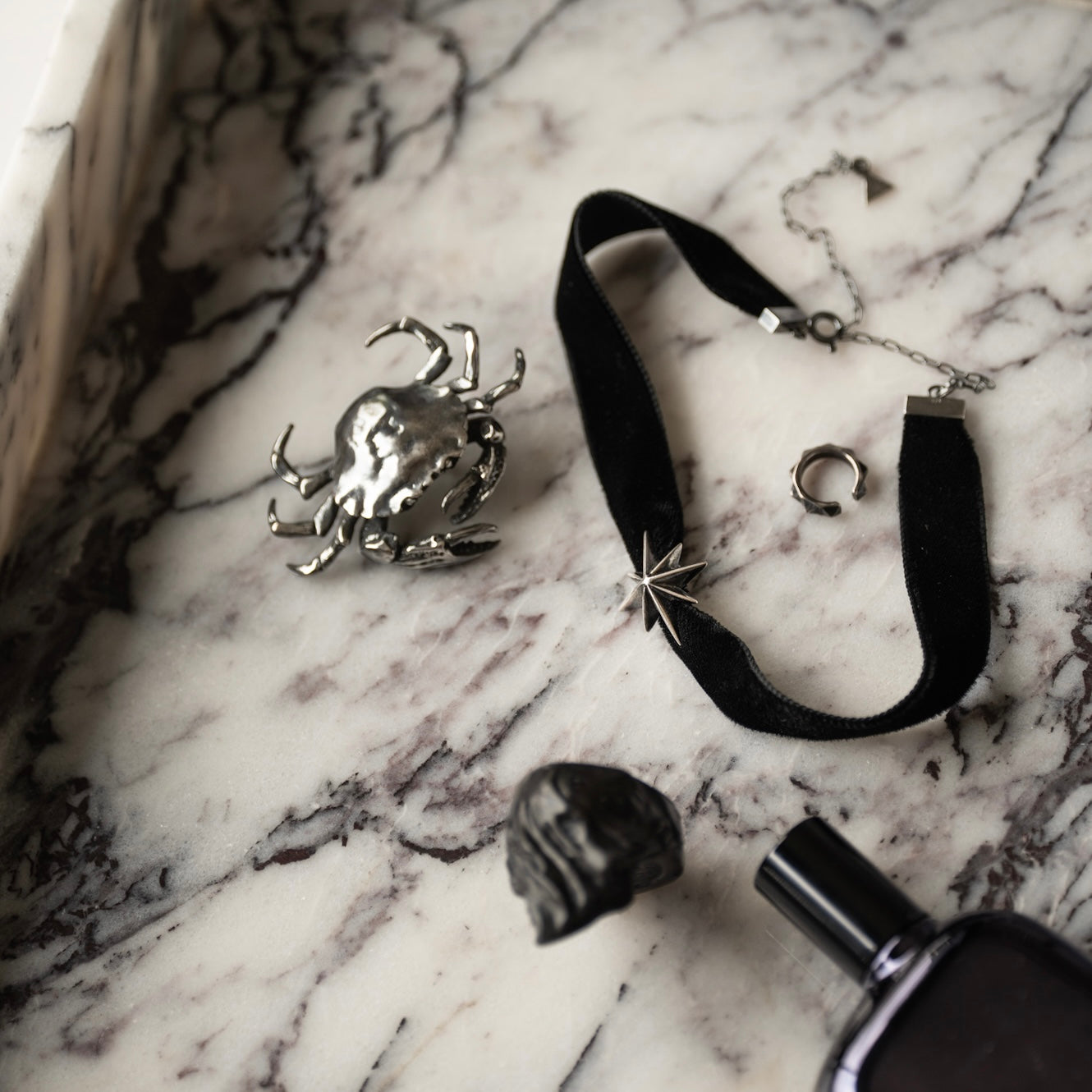 Silver Star Choker styled with Crab Brooch and Pyramids Earcuff on marble — celestial jewelry by Macabre Gadgets
