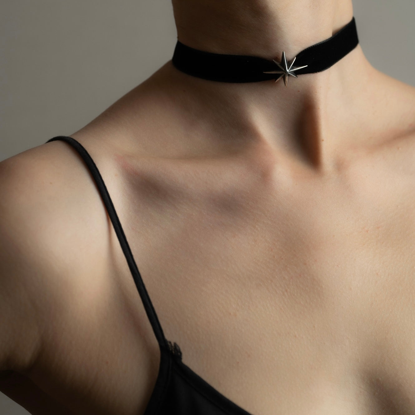 Silver Star Choker worn by model in summer dress — unisex celestial necklace by Macabre Gadgets