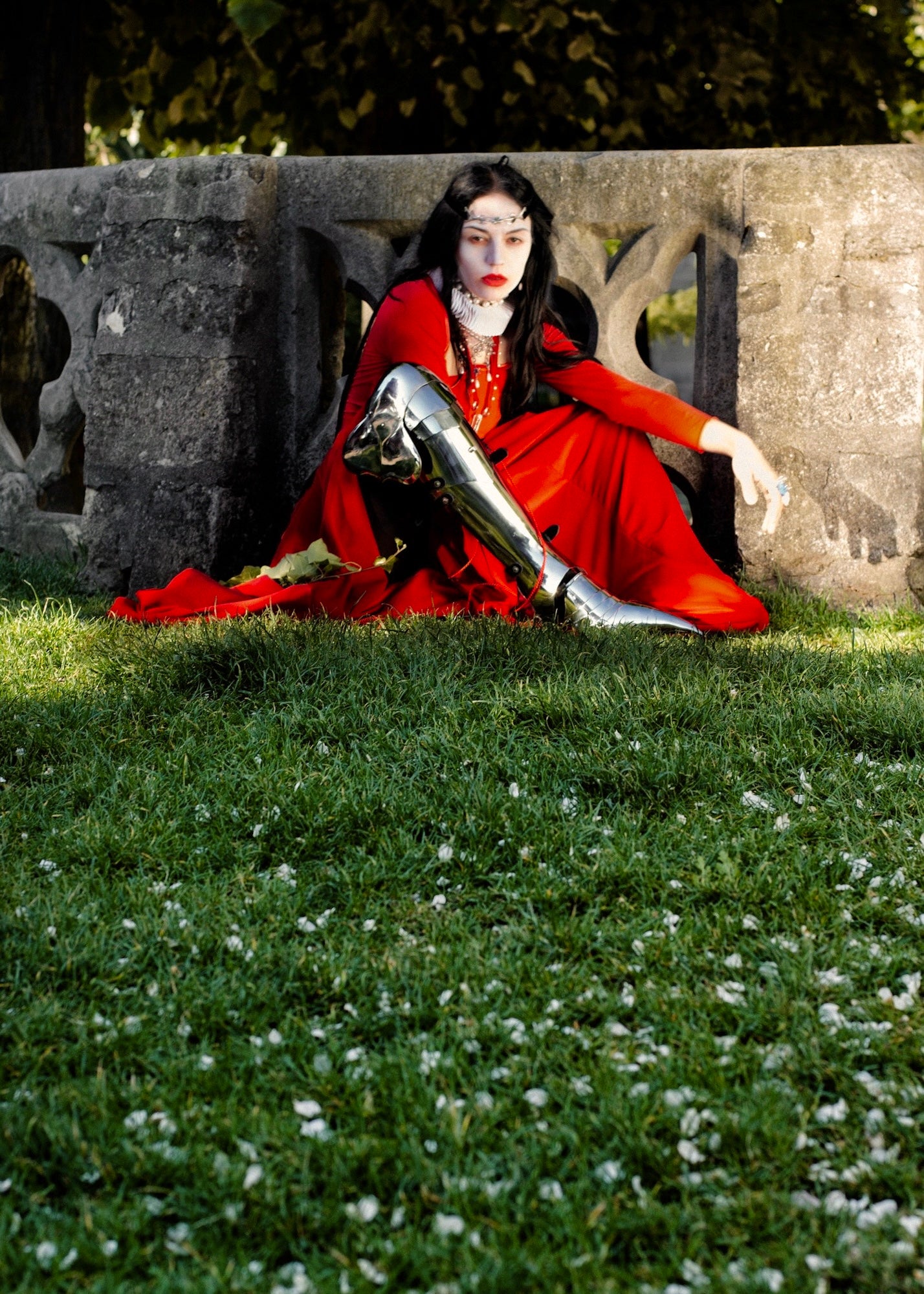 Crowned countess in armour leg and crimson velvet gown, heavy jewels, funerary attire — Vampire fashion editorial by Macabre Gadgets, Gothic Medieval