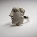 Close-up of Achilles ring - focus on sculpture part with face features and handcrafted hair details