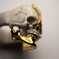 Ancient skull ring - gold variant - focus on highly polished gilded jaw of the skull
