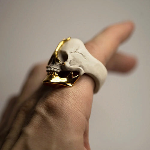 Ancient skull ring on a male's hand, to show overall dimensions and fit