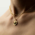 Aster pedant - multi chain necklace with a coin pendant featuring star and moon motif