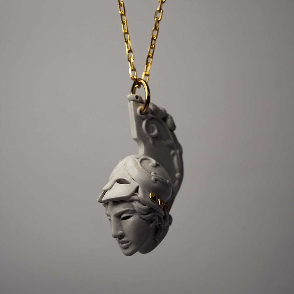 Athena pendant - placed against white background with chain and fixture visible 