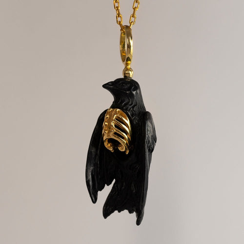 Avis Aeterna pendant - black - black and gold charm in shape of a bird