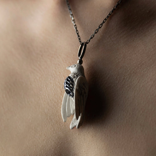 Avis Aeterna pendant - gothic bird pedant on model's neck