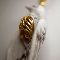 Avis Aeterna pendant - close-up of charm in shape of a bird with gilded rib cage