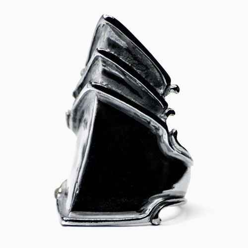 This image features a distinct ring crafted from oxidised sterling silver (925). The ring showcases a unique design that combines both traditional and modern elements, resulting in a striking appearance.