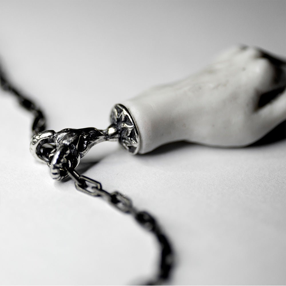 Capere Sidus pendant on a white background, close-up of a fixture and anchor chain