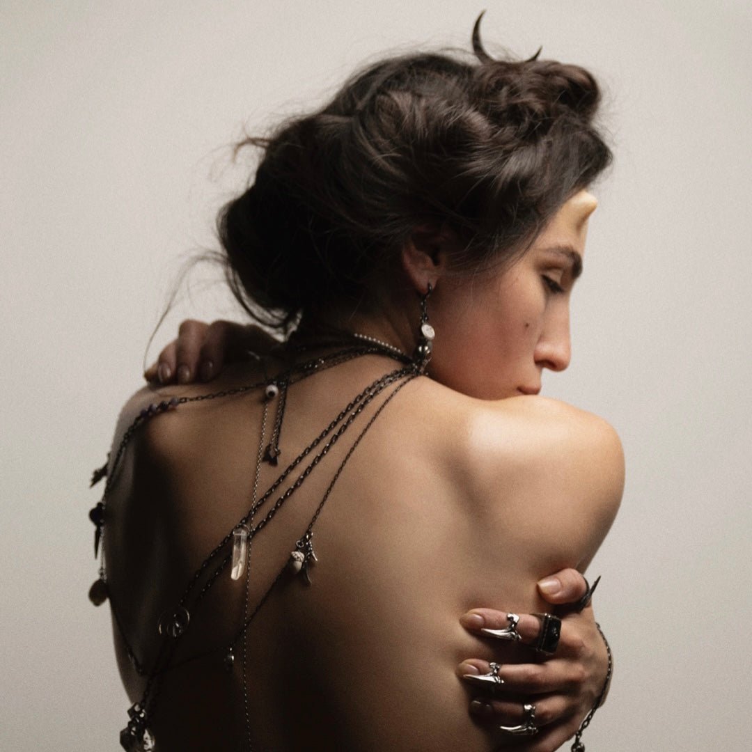Claw phalanx ring - on a female model, along with other jewelry by Macabre Gadgets for the campaign of Faun collection