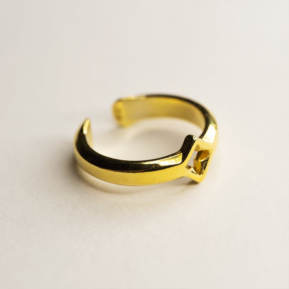 Gothic Clover ear cuff - gold-plated gothic window ear cuff on white surface