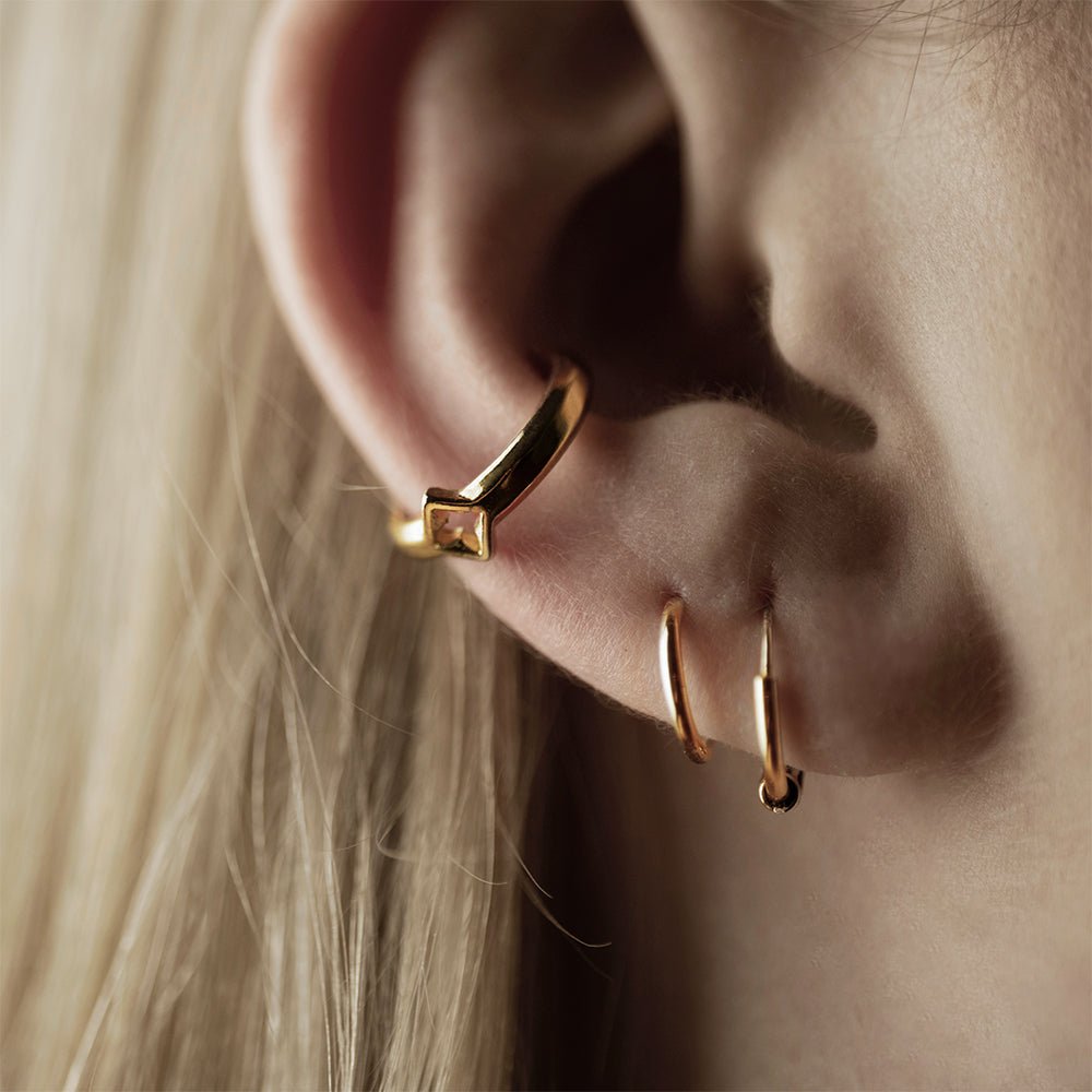Female model wearing Gothic Clover ear cuff - gold-plated gothic inspired no piercing jewelry