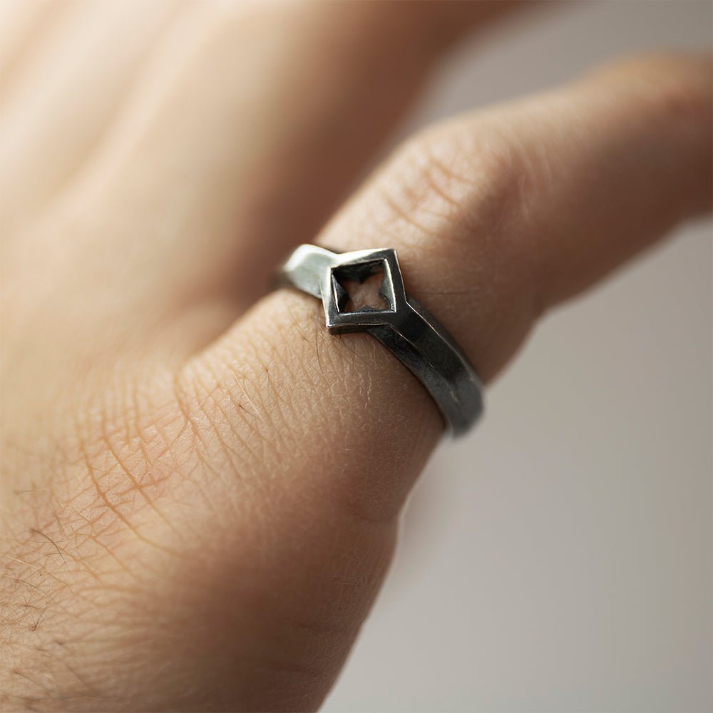 Gothic Clover Ring - close up on a pinky finger 