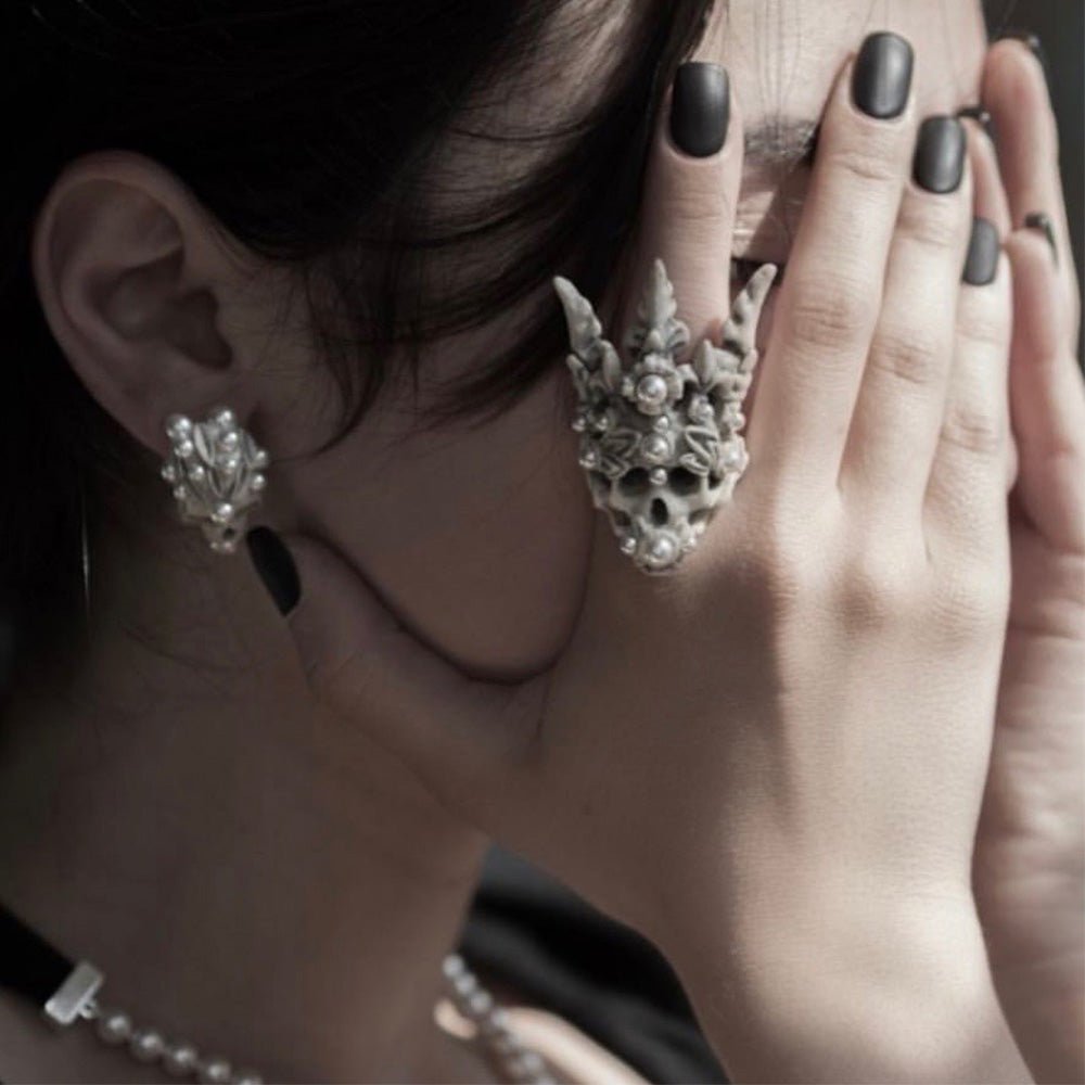 Female model wearing Coral Crown Skull ring — marble skull ring with coral pearl crown on hand | Macabre Gadgets