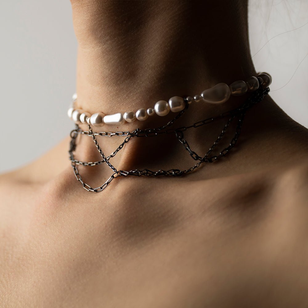 Dew necklace on a woman's neck, semi-profile view to demonstrate overall fit and dimensions