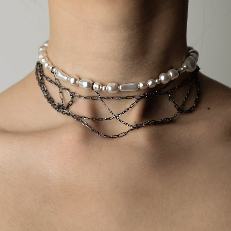 Dew necklace on a model's neck, front view