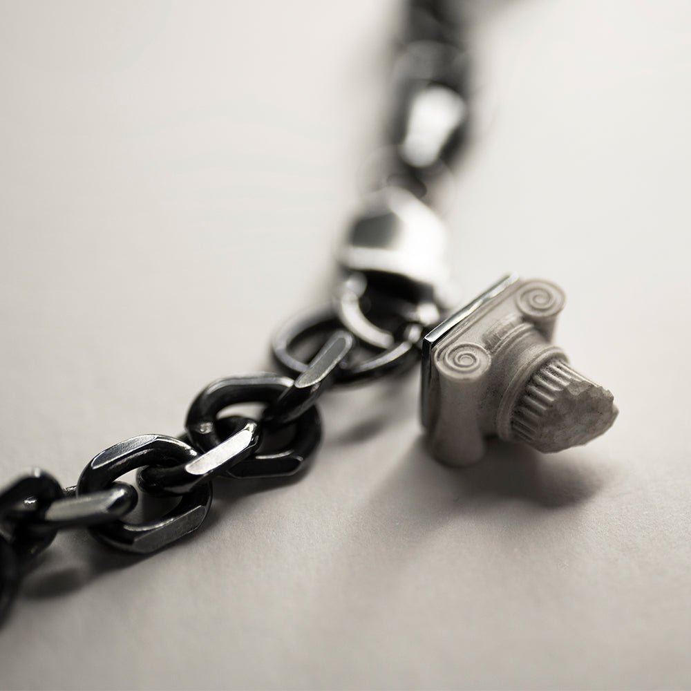 Ionic bracelet - close-up view of the ionic charm, the bracelet is made from sterling silver (925) anchor chain and features bonded marble ionic charm in shape of ionic column capital