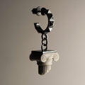 Ionic earring - shaped like a fallen off ionic column capital  earring this earring crafted in bonded white marble and oxidised sterling silver, creating an antique marble statue effect.