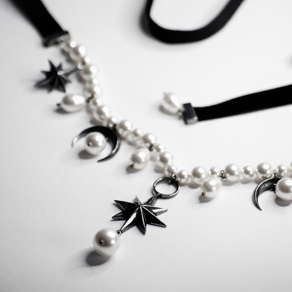 Stars and Moons choker on a white surface, satin ribbons are visible