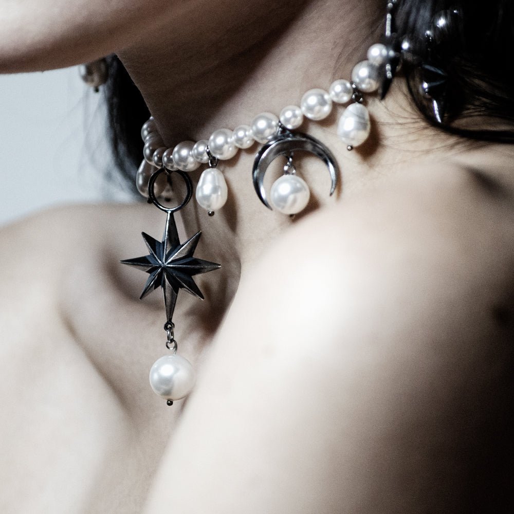 Stars and Moons choker on a female model, close up on the star - centrepiece of the necklace 