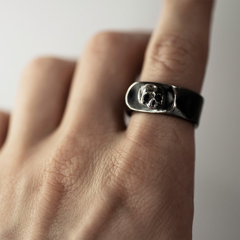 Flow ring on model's hand - gothic skull ring styling shot