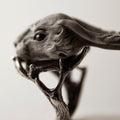 Hare ring - grey variant - close up of the hare's head, shows also how ring "holds" the head