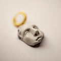 Helen earring - sculpted marble face of Helen of Troy on gold-plated huggie clasp