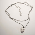 Helen pendant - multi chained necklace with marble charm - on white surface