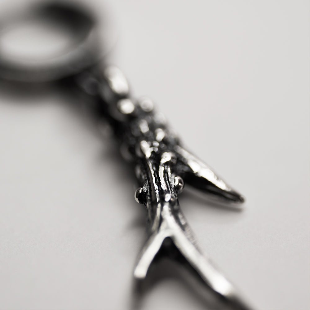 Close-up of Horn earring - showing sculpted texture of sterling silver horn