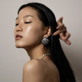 Female model wearing Large Seashell stud earring - chunky sterling silver earring