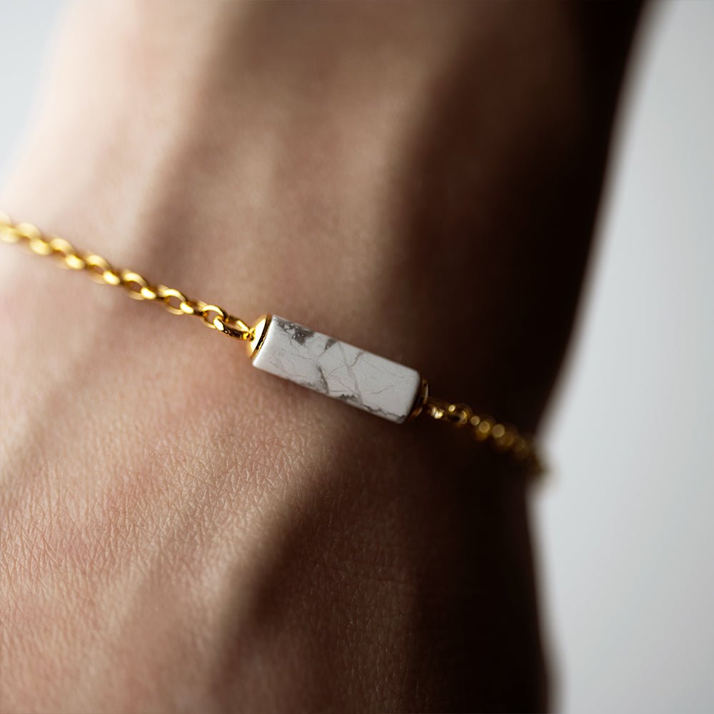 Marble Bracelet - gold variant - on a wrist, focus on the howlite detail