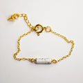 Marble Bracelet - gold variant - clear product picture on a white surface, howlite bead, lobster clasp and anchor chain are clearly visible