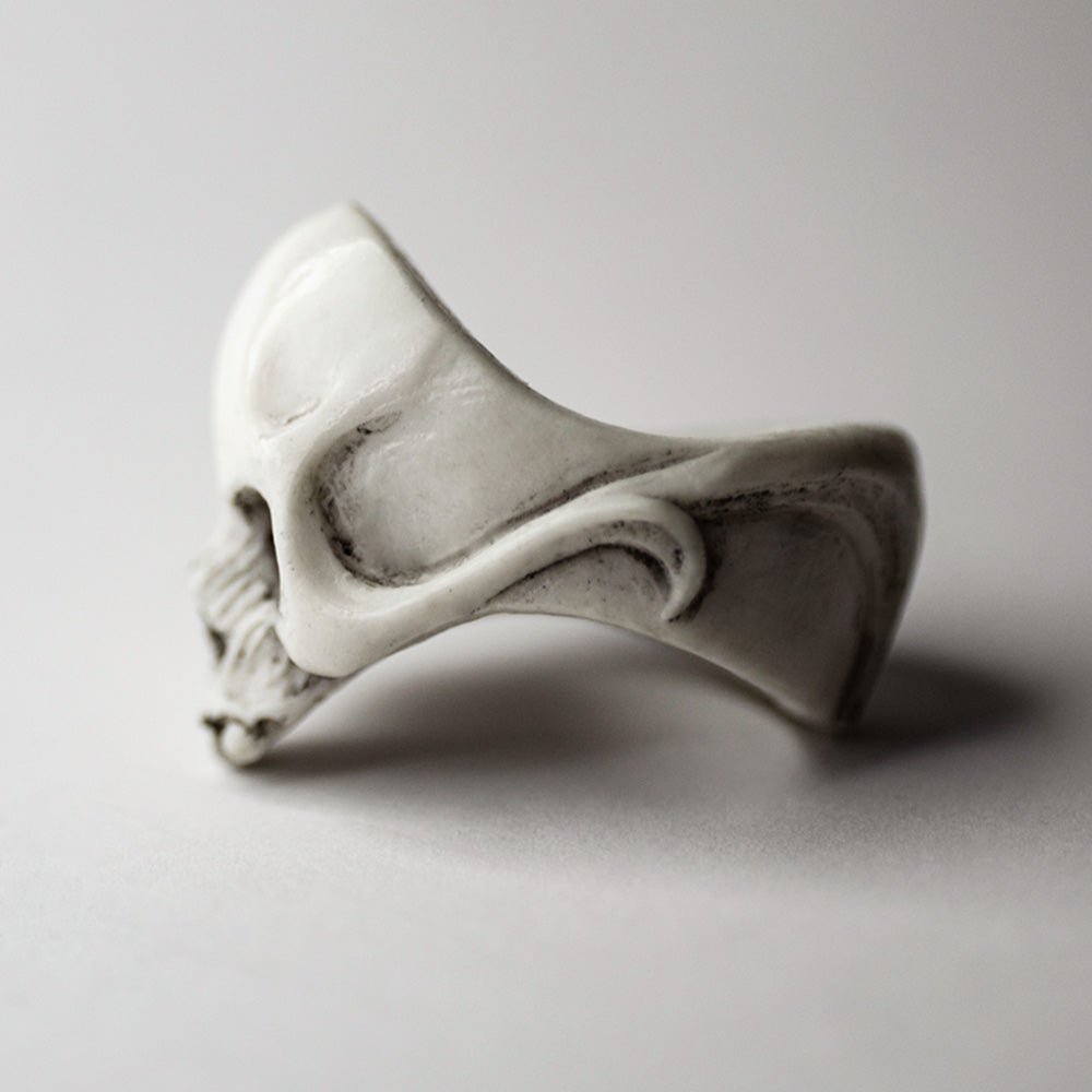Skull ring - profile view - focus on the sculpted details of the ring