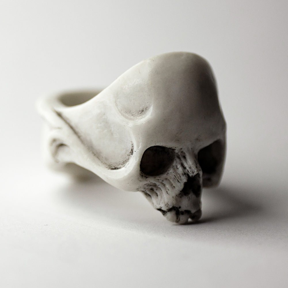Skull ring - white netsuke-like no jaw gothic skull ring on neutral surface