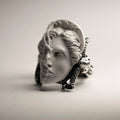 Medea ring front view — marble face of Medea in moon phase coronet flanked by ram skull details on solid sterling silver band