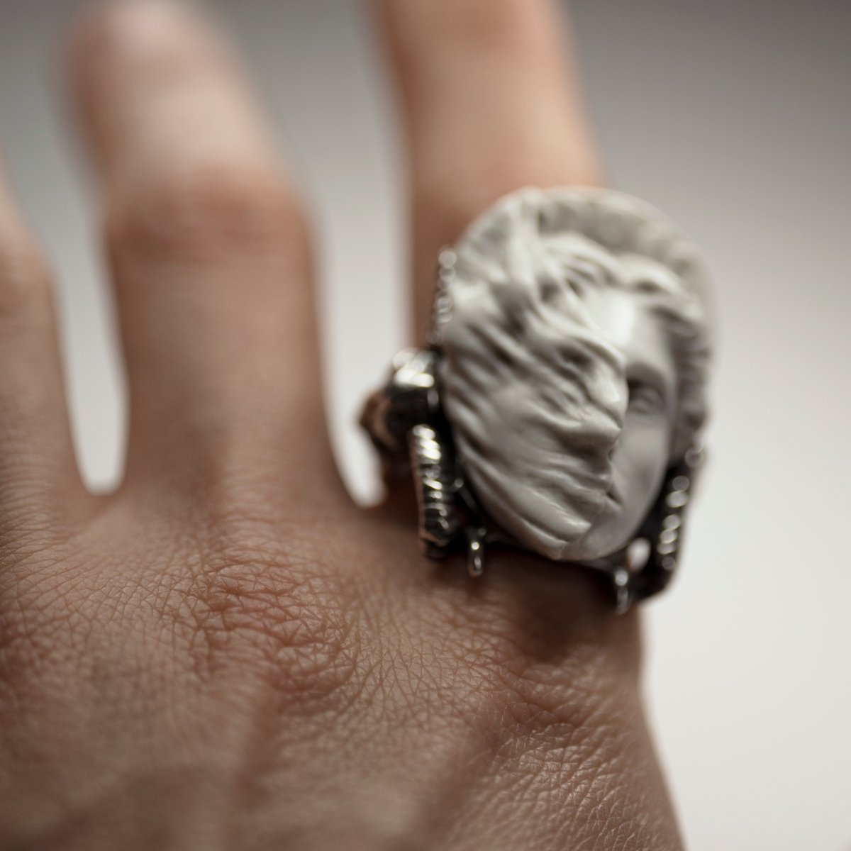 Model wearing Medea ring — sculptural greek mythology signet ring in sterling silver and marble, statement ring on index finger