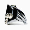 Close-up of Mercurius ring - Sterling silver ring in a shape of winged helmet with marble face on white background
