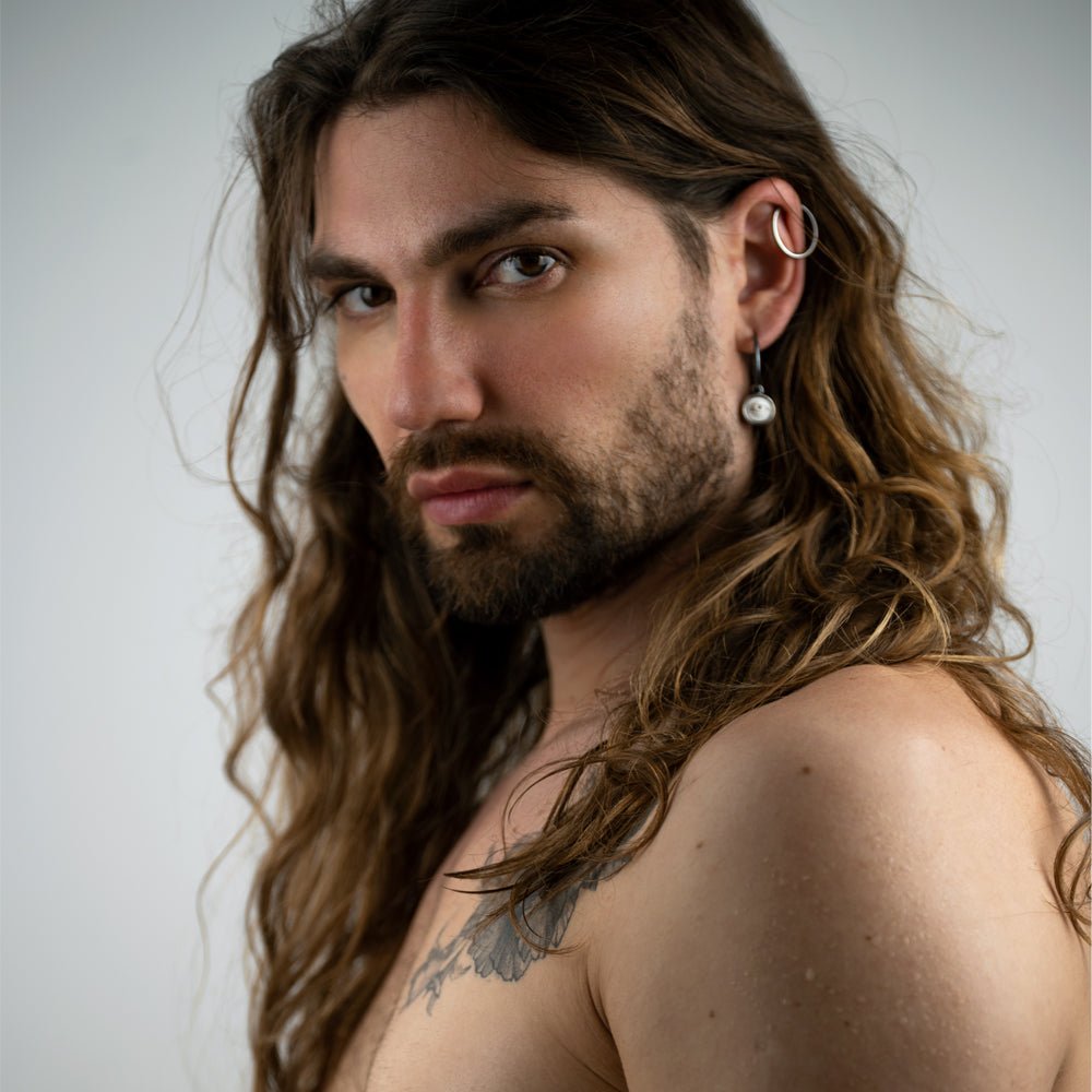 Male model wearing Oracle eye earring - sterling silver gothic earring