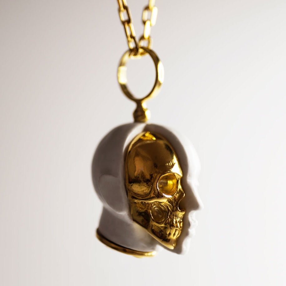 Oracle Skull pendant - semi-front view against beige background